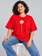 Red Love Yourself Daisy Printed Oversized T-Shirt — seated model view
